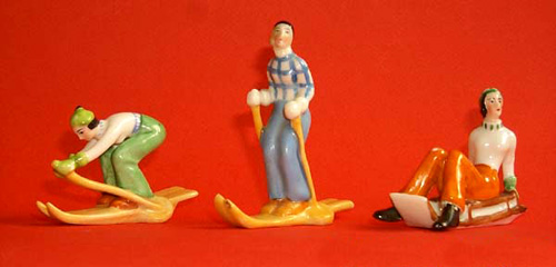 Figurines of females skiing and sledging (Sold)